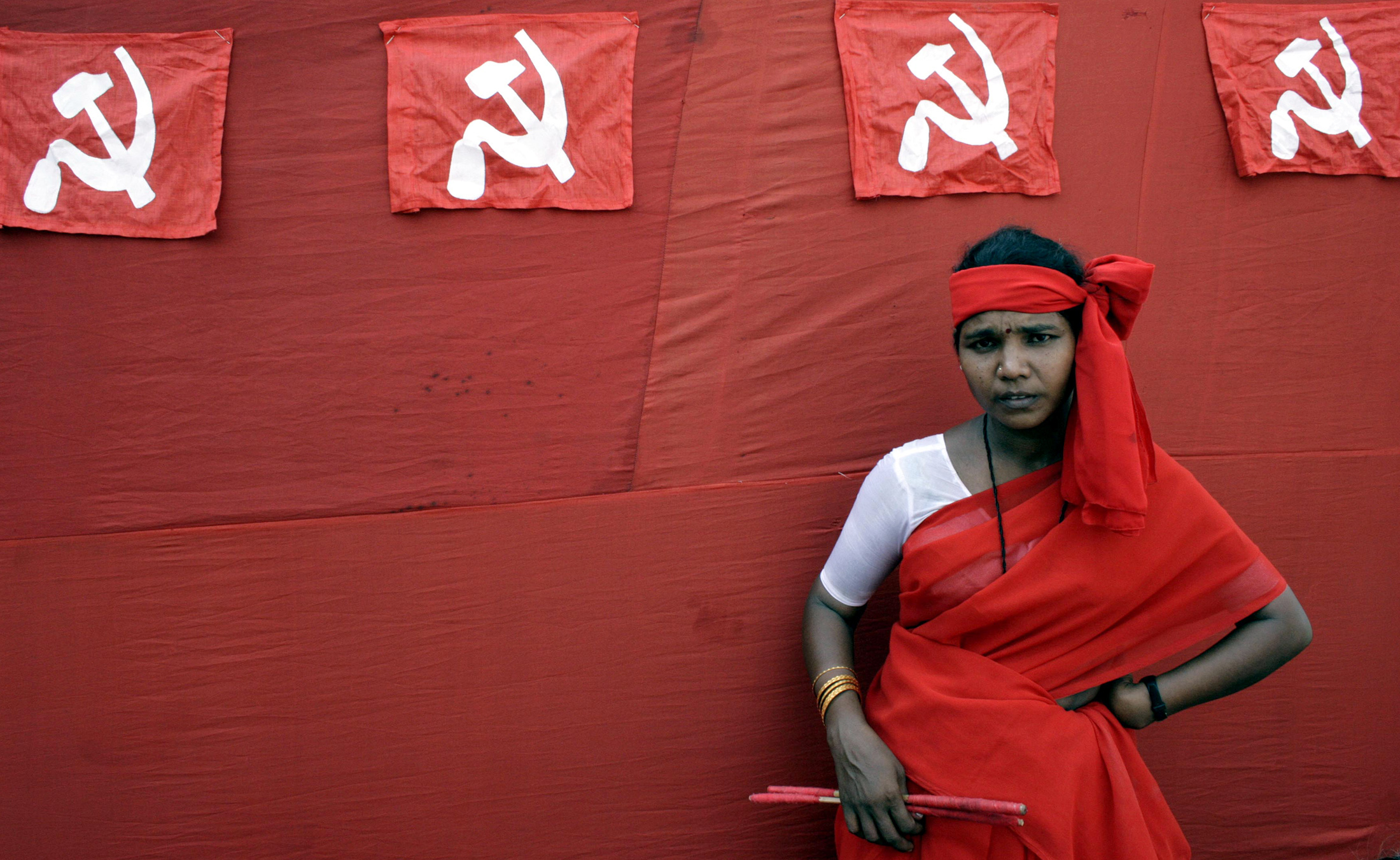A woman naxalite waits before her performance during a protest rally in Kolkata